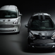 A black and a silver Aston Martin Cygnet city cars